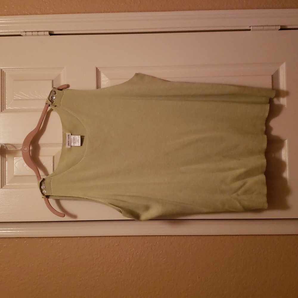 Light green sleeveless top with buttons on shoulders